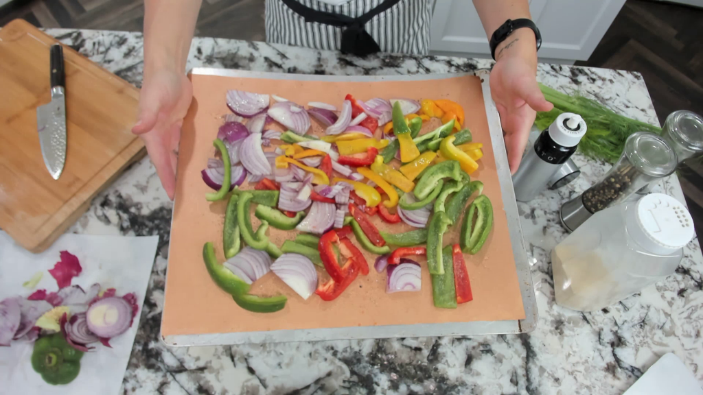 peppers and onions on a sheet pan