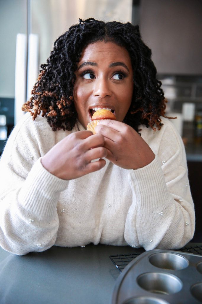 woman addicted to sugar and carbs eating a cupcake